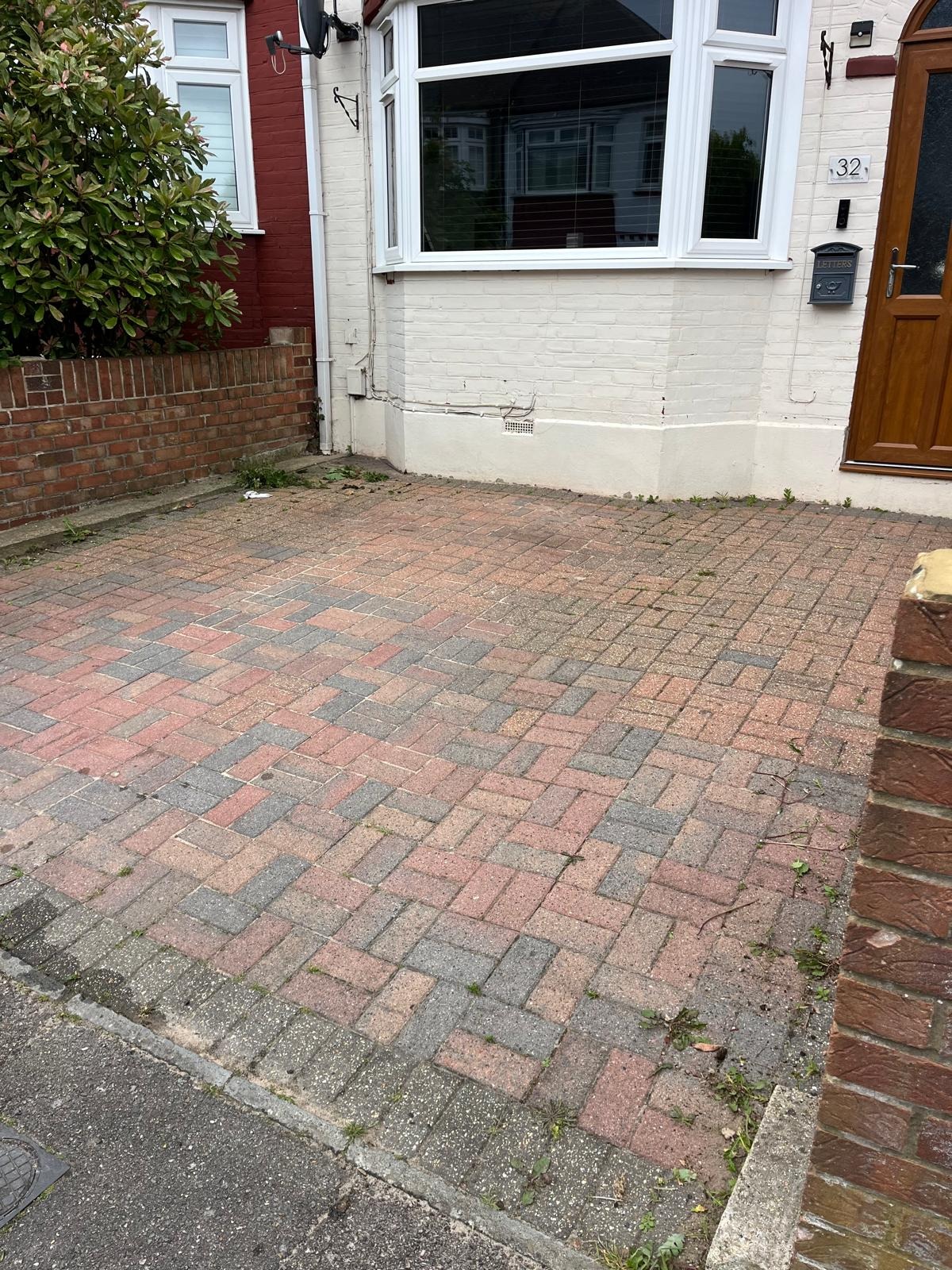 Moss-stained block paving before cleaning in Kent