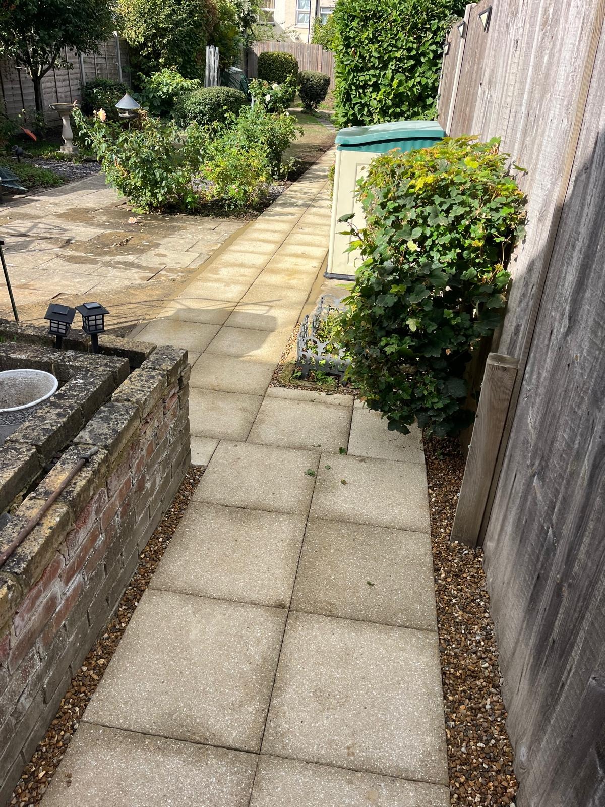 Newly laid garden path alongside a fence in Kent
