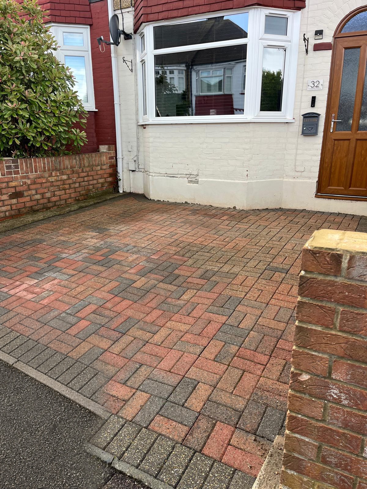 Block paved front driveway cleaned and re-sanded outside a Kent home