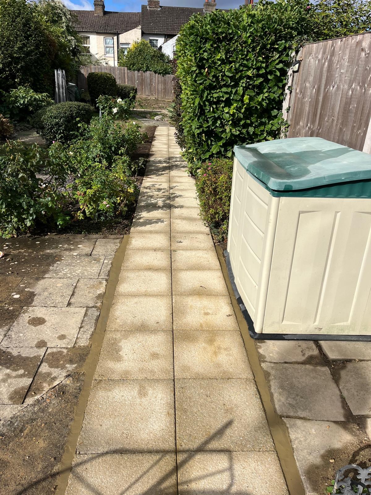 Slabbed garden path running down a garden in Kent