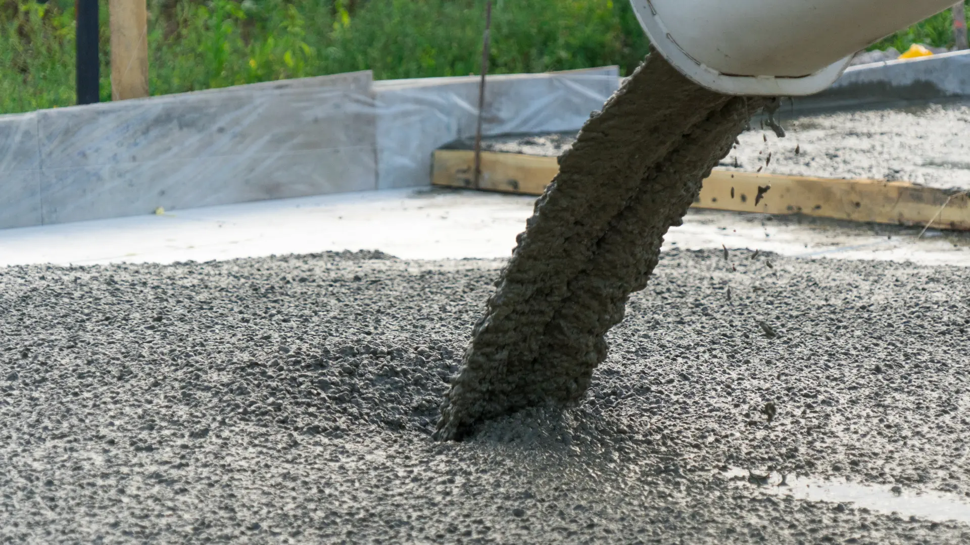 Ready-mix concrete poured into a shuttered base for a garden building in Kent