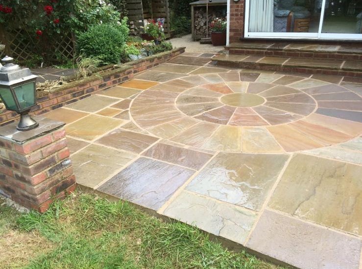 Sandstone patio with circle feature in Kent