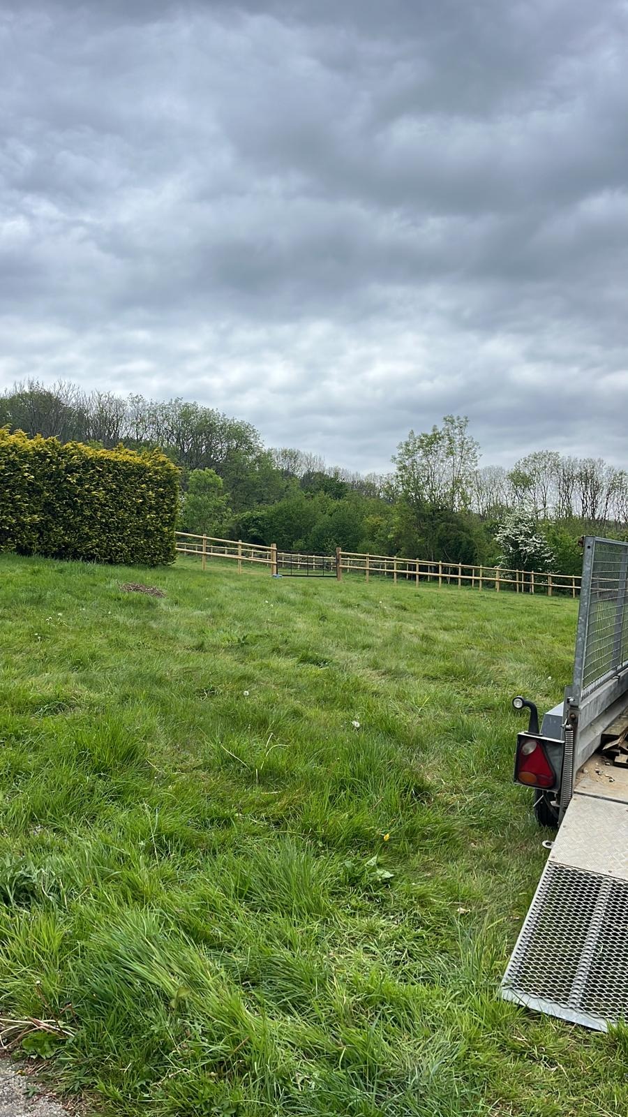 Post and rail fencing around a paddock in Kent